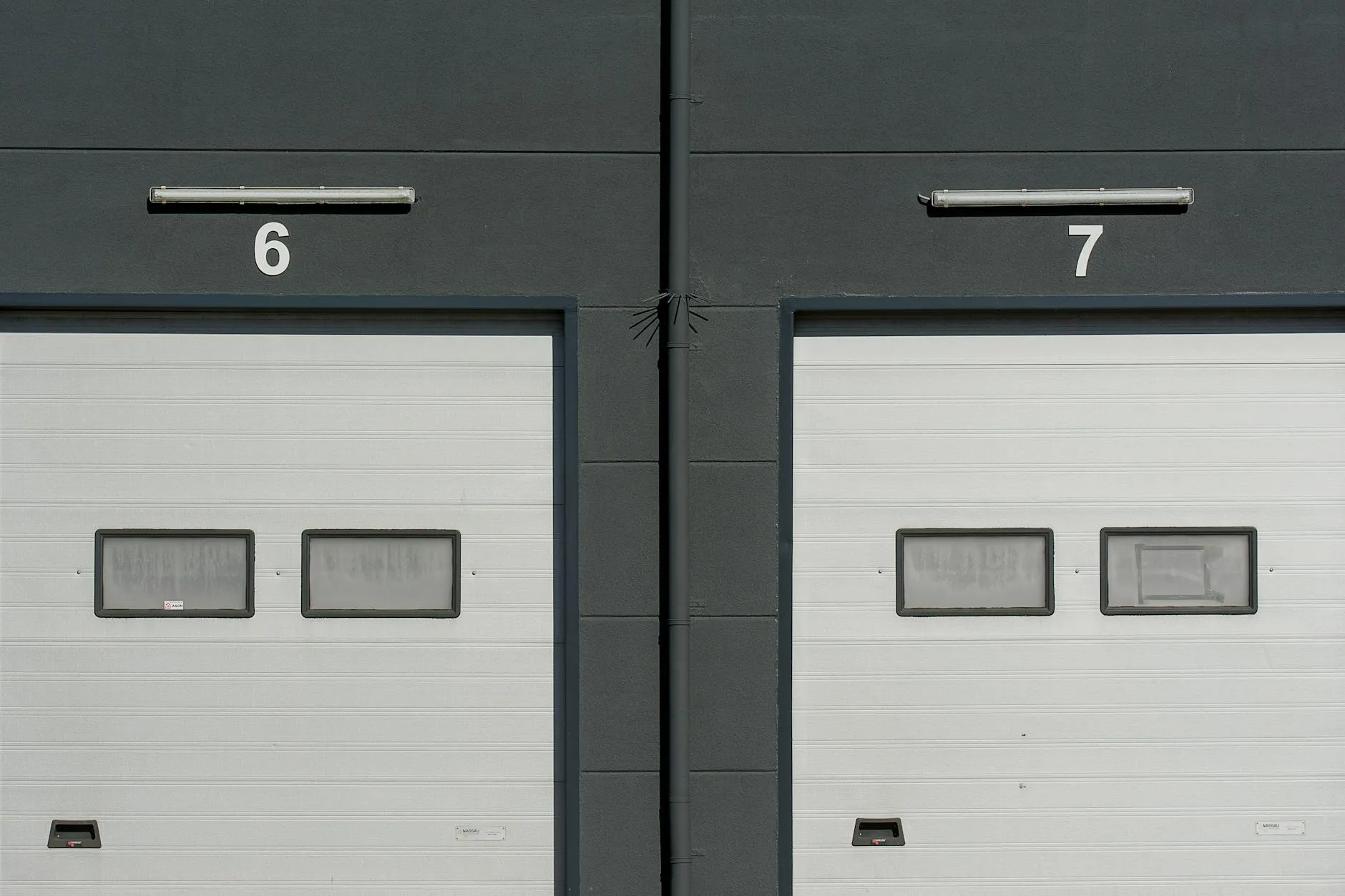Commercial garage door services in Alabama - large commercial bay doors on industrial building